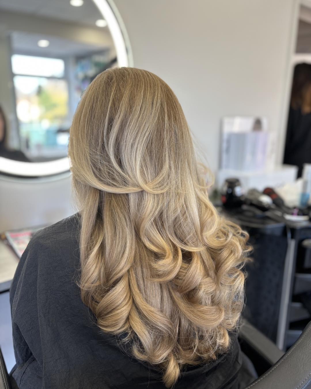 ash toned highlights on a long layered hair cut