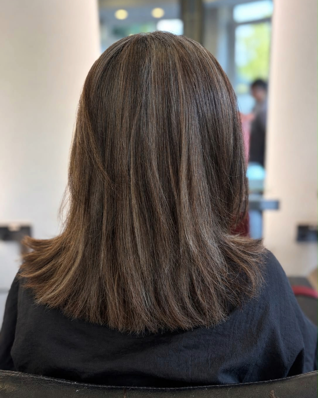 after picture of brunette mid length hair after regrowth tint to cover grey