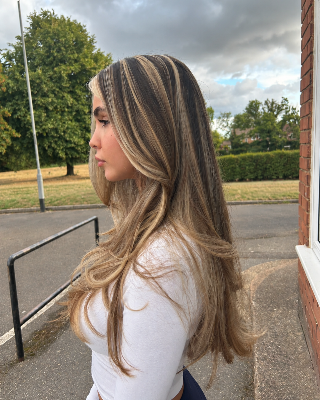 after picture of chunky blonde highlights on brunette hair carried out at brooklyns hair salon in high wycombe