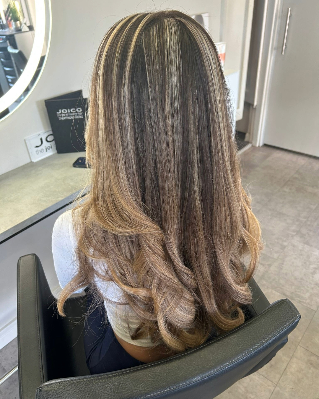 chunky blonde highlights on brunette hair carried out at brooklyns hair salon in high wycombe